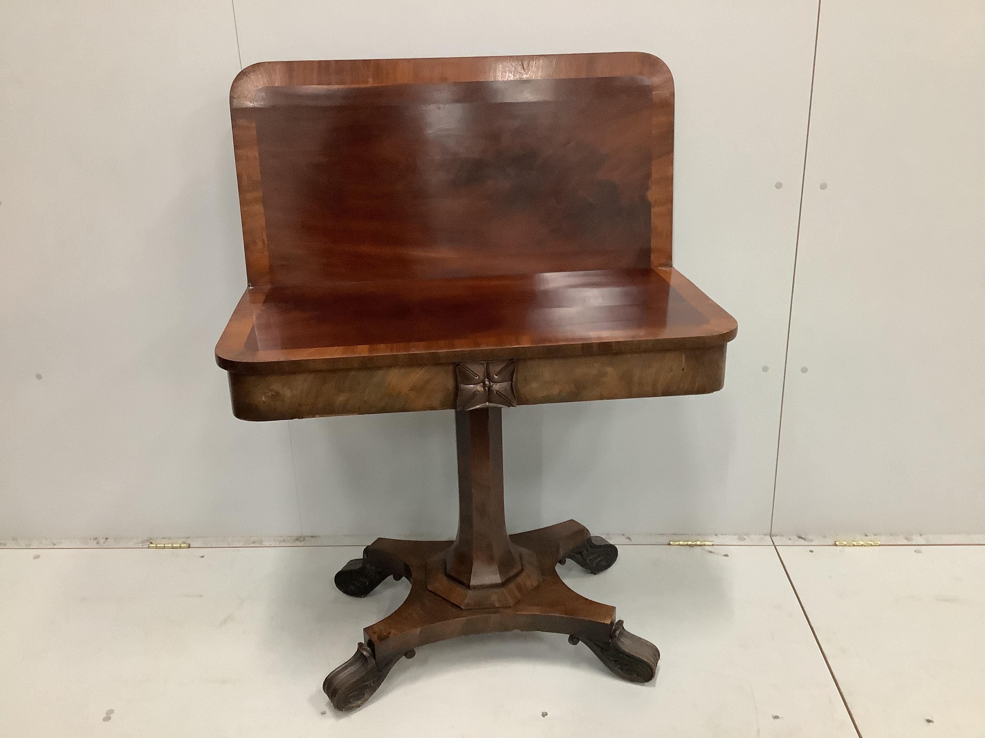 An early Victorian banded mahogany folding tea table, width 92cm, depth 45cm, height 78cm